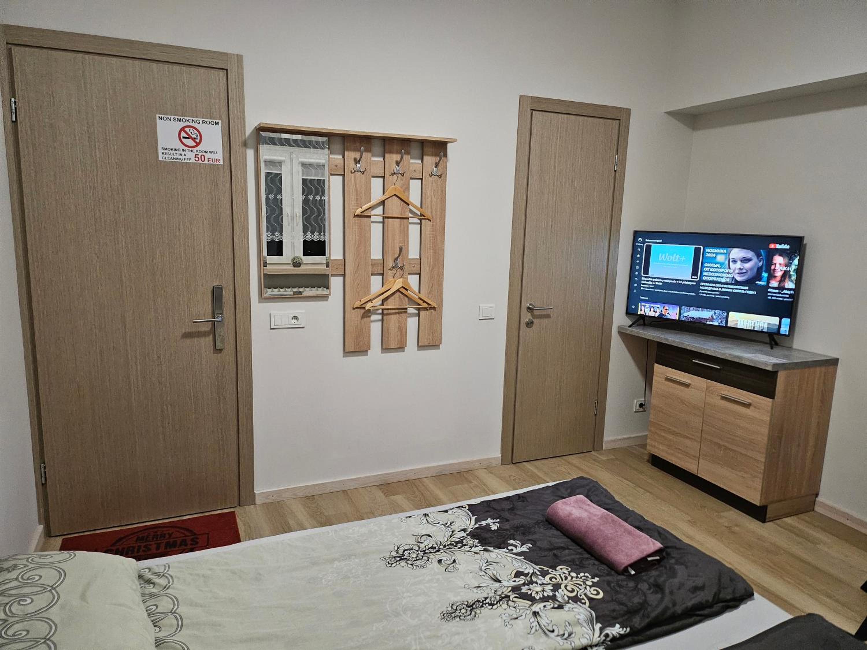 Kauno apartamentai king size bed view 4