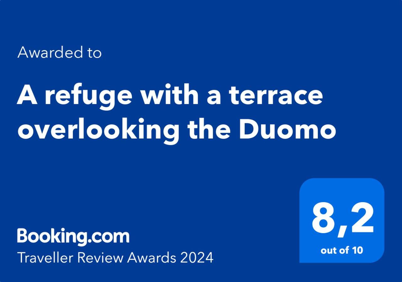A refuge with a terrace overlooking the Duomo