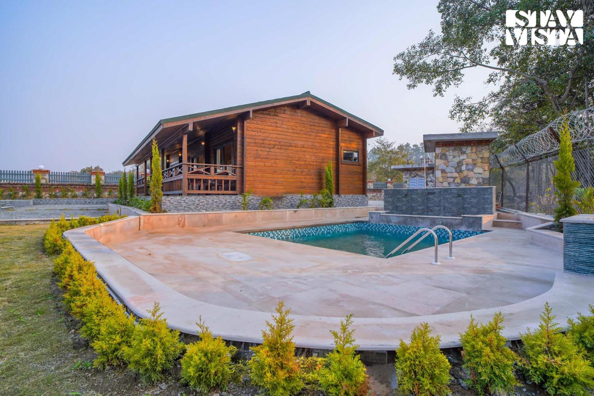 Secret Solace with Swimming Pool & Porch at Dehradun by StayVista view 3