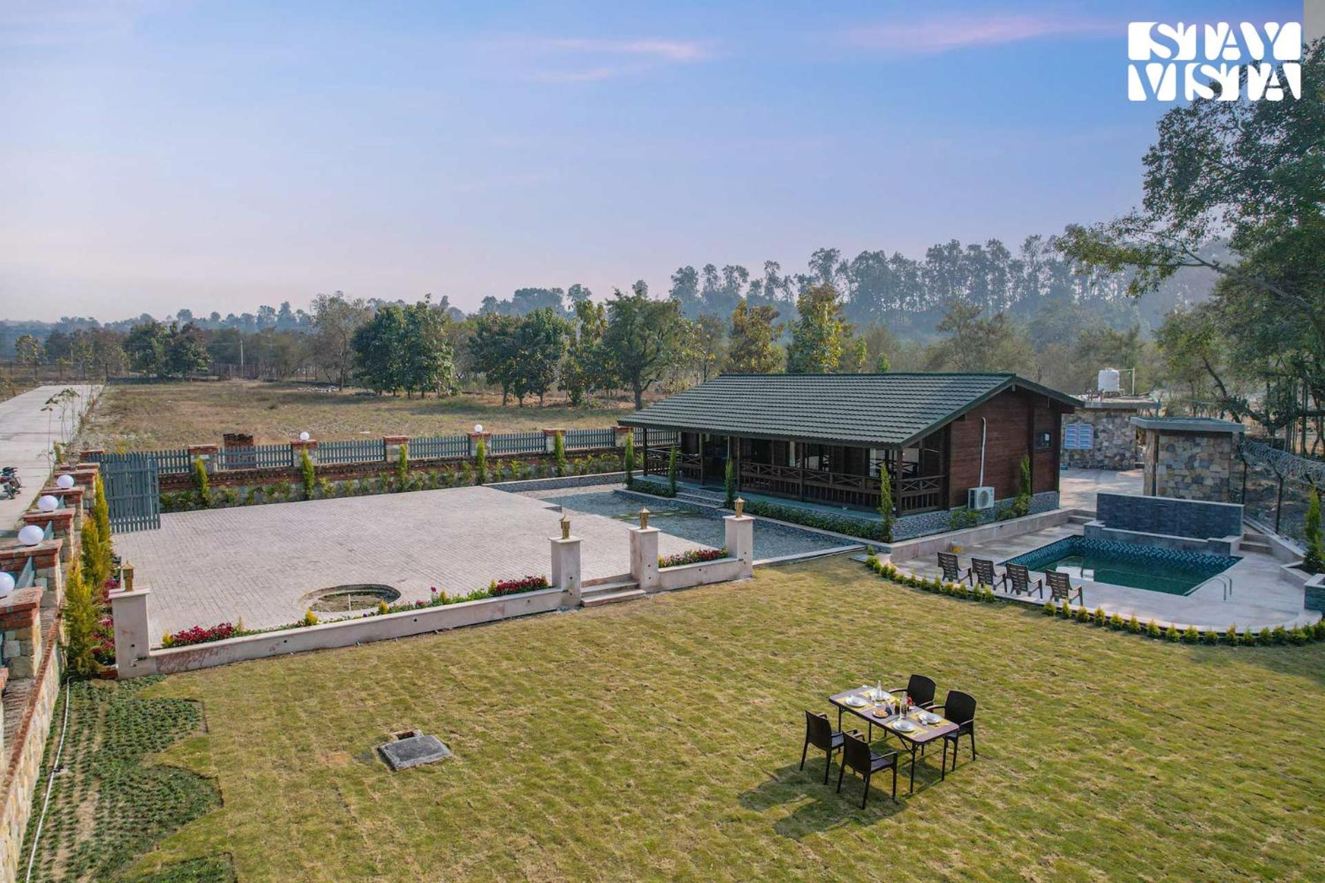 Secret Solace with Swimming Pool & Porch at Dehradun by StayVista view 4