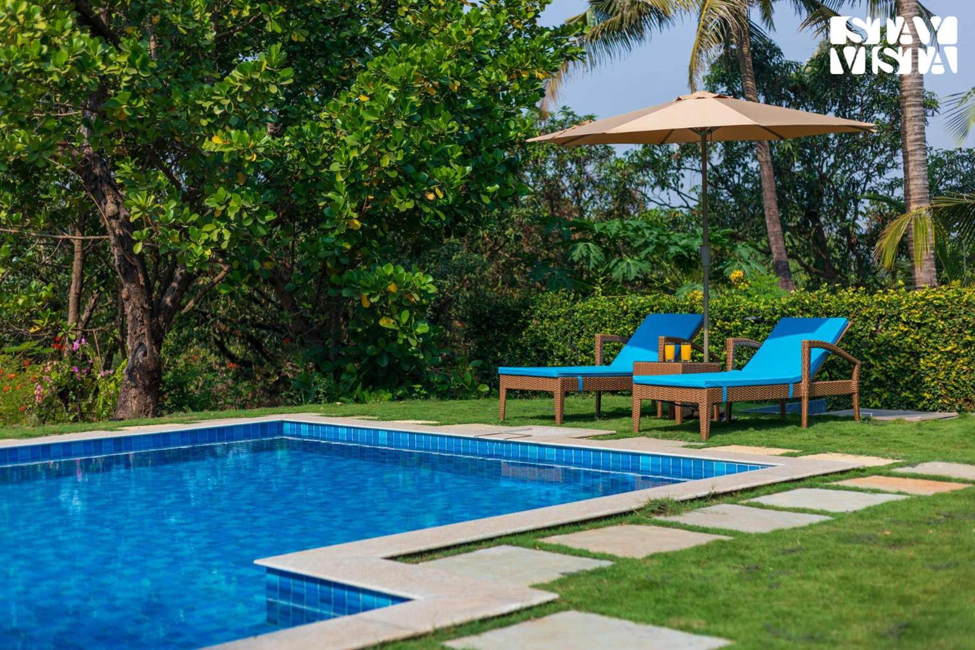 The Courtyard by StayVista - Private Pool with Rustic Charm, Vibrant Courtyard, Spacious Verandah & Garden view 2