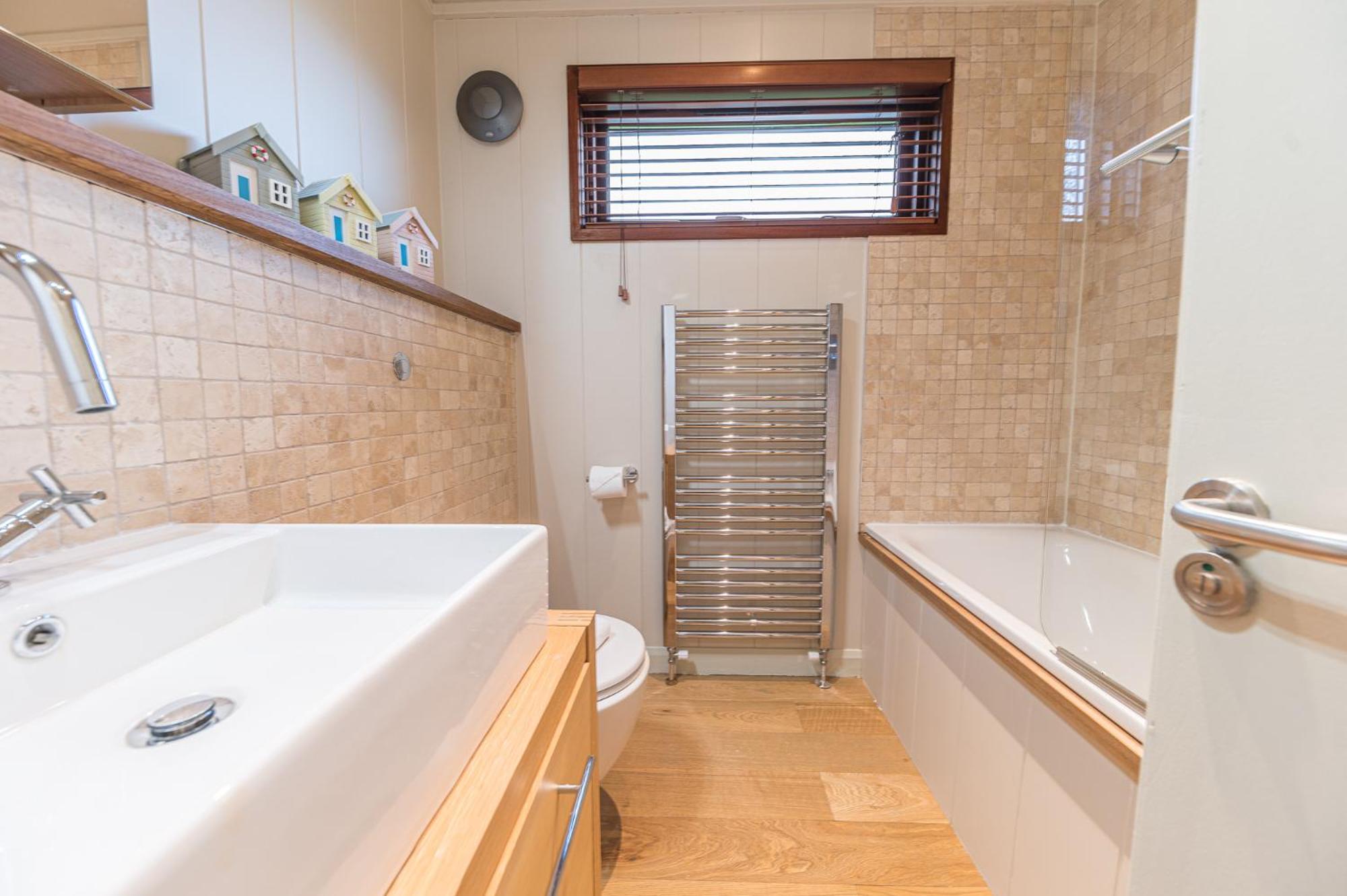 Family friendly, lovely Lakeland lodge with private parking and a patio