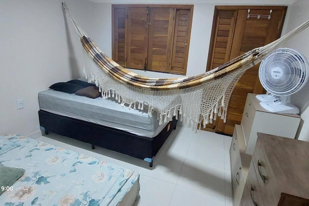 Casa na Praia com Super Piscina, em Condomínio Fechado.