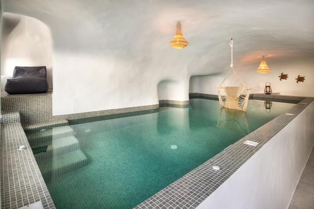 Mystagoge Retreat cave with an indoor pool and gym view 4