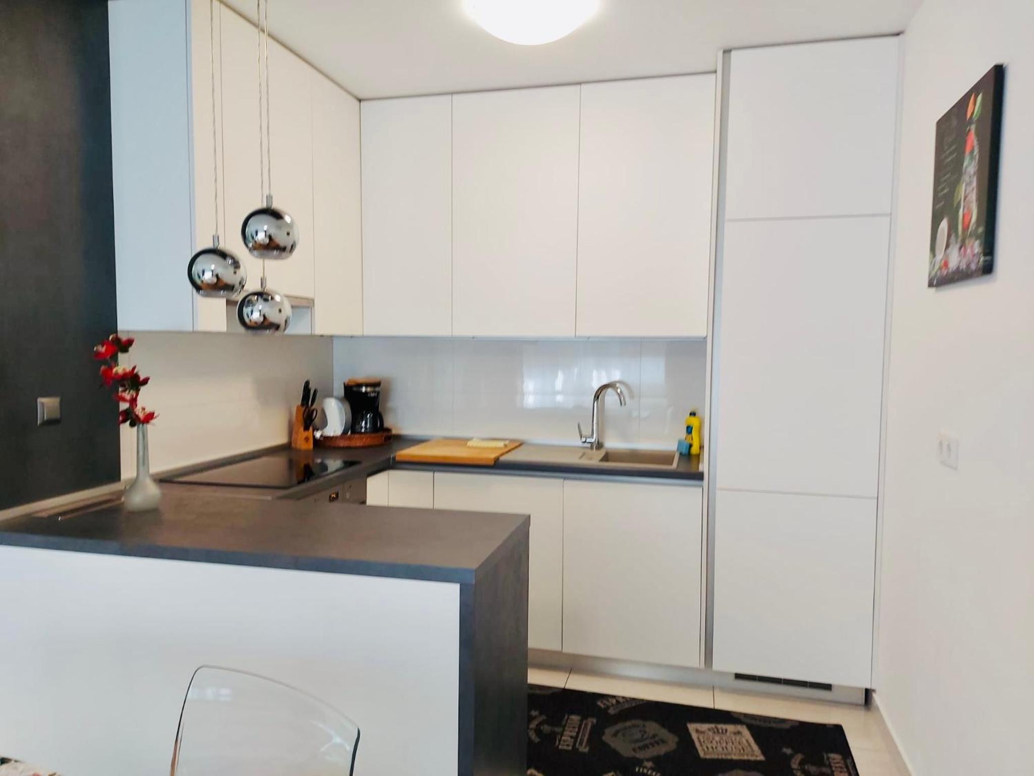 West Residence Luxury Apartment- parking in garage view 4