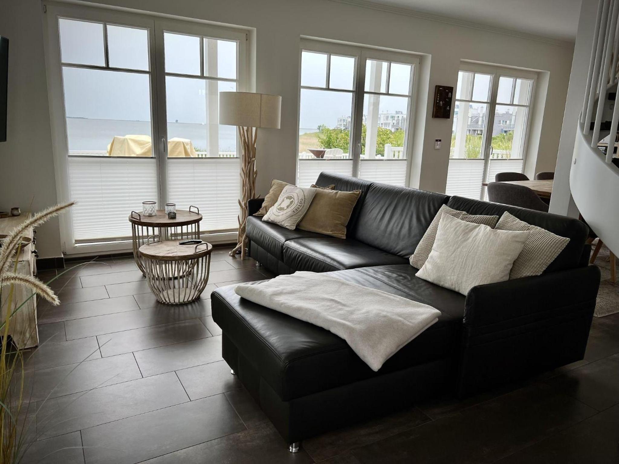 Ferienhaus-Sliminde-by-Seeblick-Ferien-direkte-Wasserlage-E-Ladesaeule-Sauna