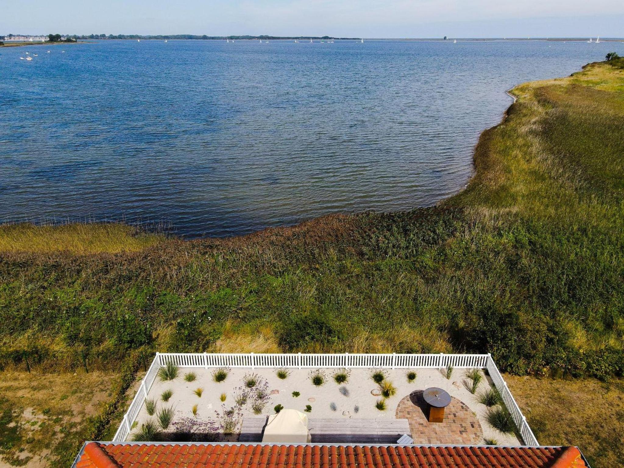 Ferienhaus-Sliminde-by-Seeblick-Ferien-direkte-Wasserlage-E-Ladesaeule-Sauna