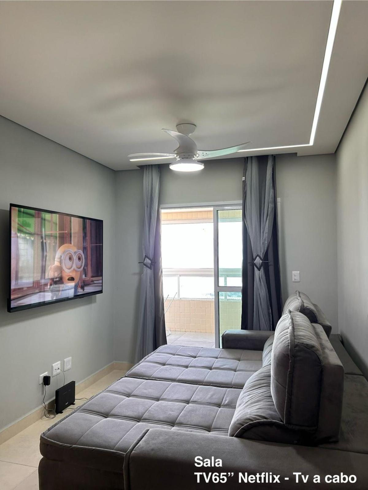 APTO BEIRA MAR - ACONCHEGANTE _ VARANDA GOURMET - WIFI - NETFLIX - TV A CABO - PRAIA GRANDE