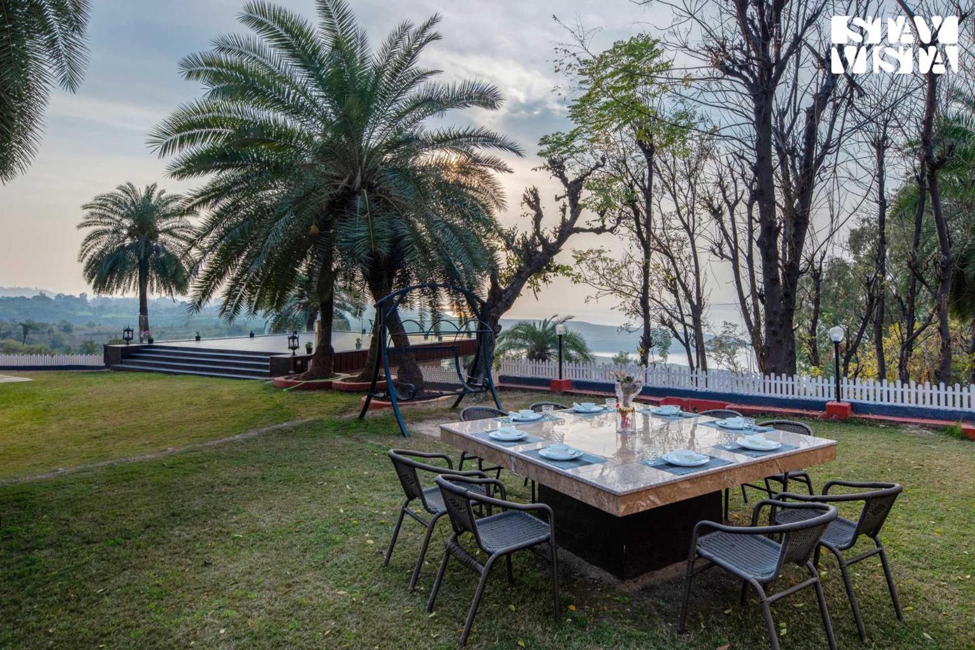 StayVista's Lake Pearl Serenity - Riverside, Mountain-View Villa with Jacuzzi, Sprawling Lawn & Terrace view 4