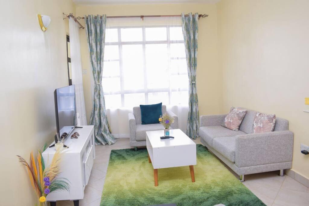 Marvel Homes Modern 1BR Fast WiFi Balcony Near Town Perfect for Work & Stay view 2