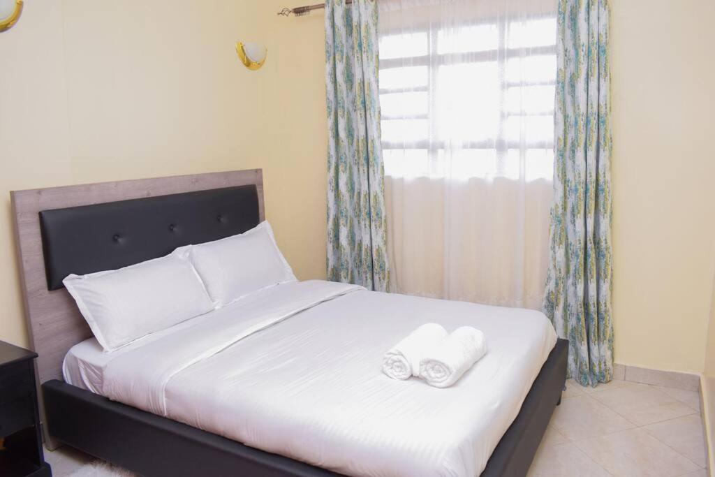 Marvel Homes Modern 1BR Fast WiFi Balcony Near Town Perfect for Work & Stay view 4