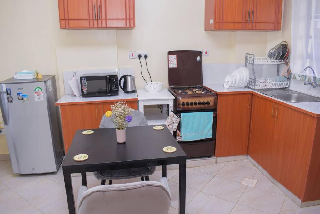Marvel Homes Modern 1BR Fast WiFi Balcony Near Town Perfect for Work & Stay view 5