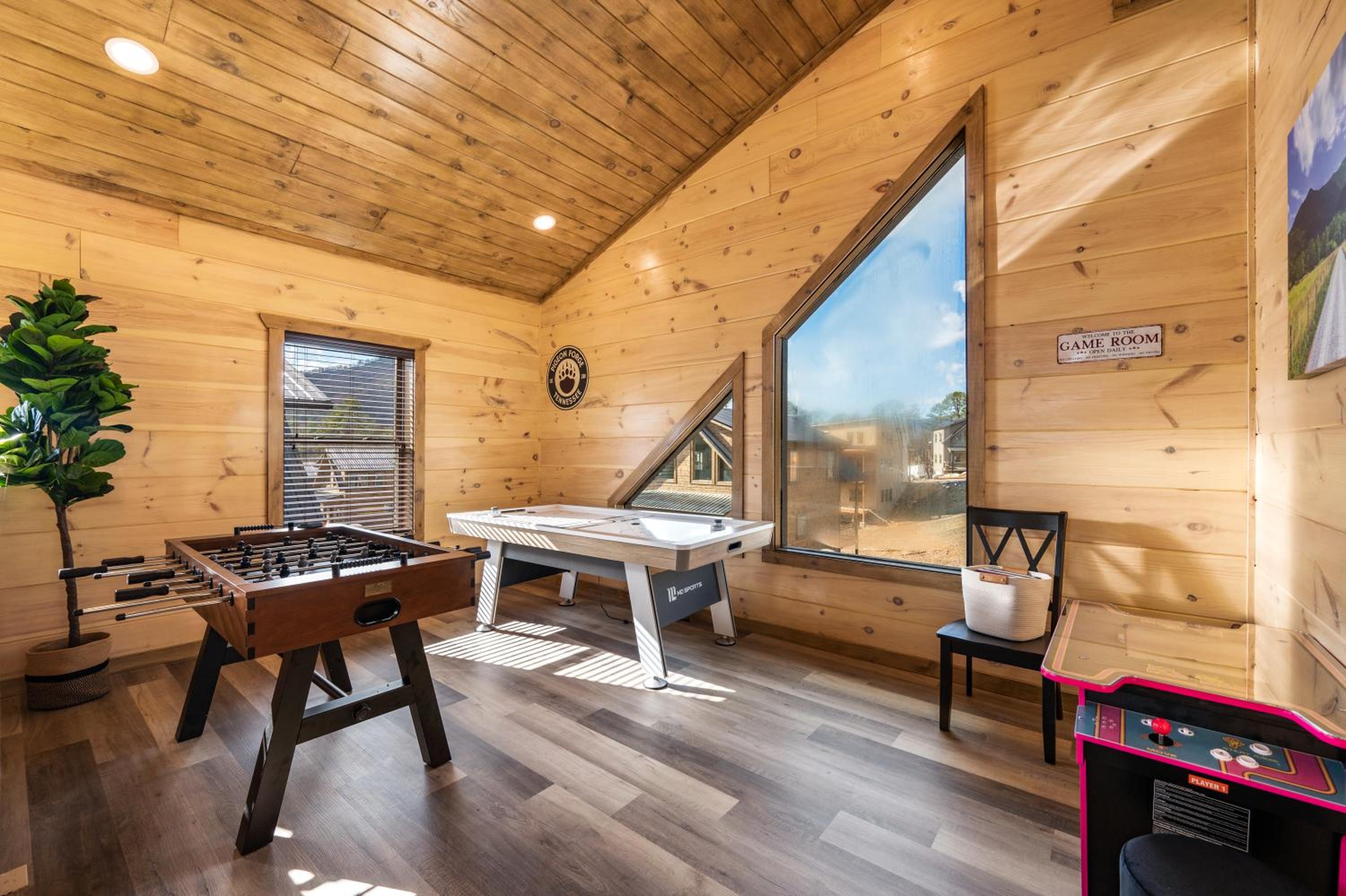 SmokiesBoutiqueCabins would love to host you at our NEW cabin! 3 King Suites, Indoor Pool, Game Room, Lounge with 75" TV! Close to Dollywood and the Parkwa view 4