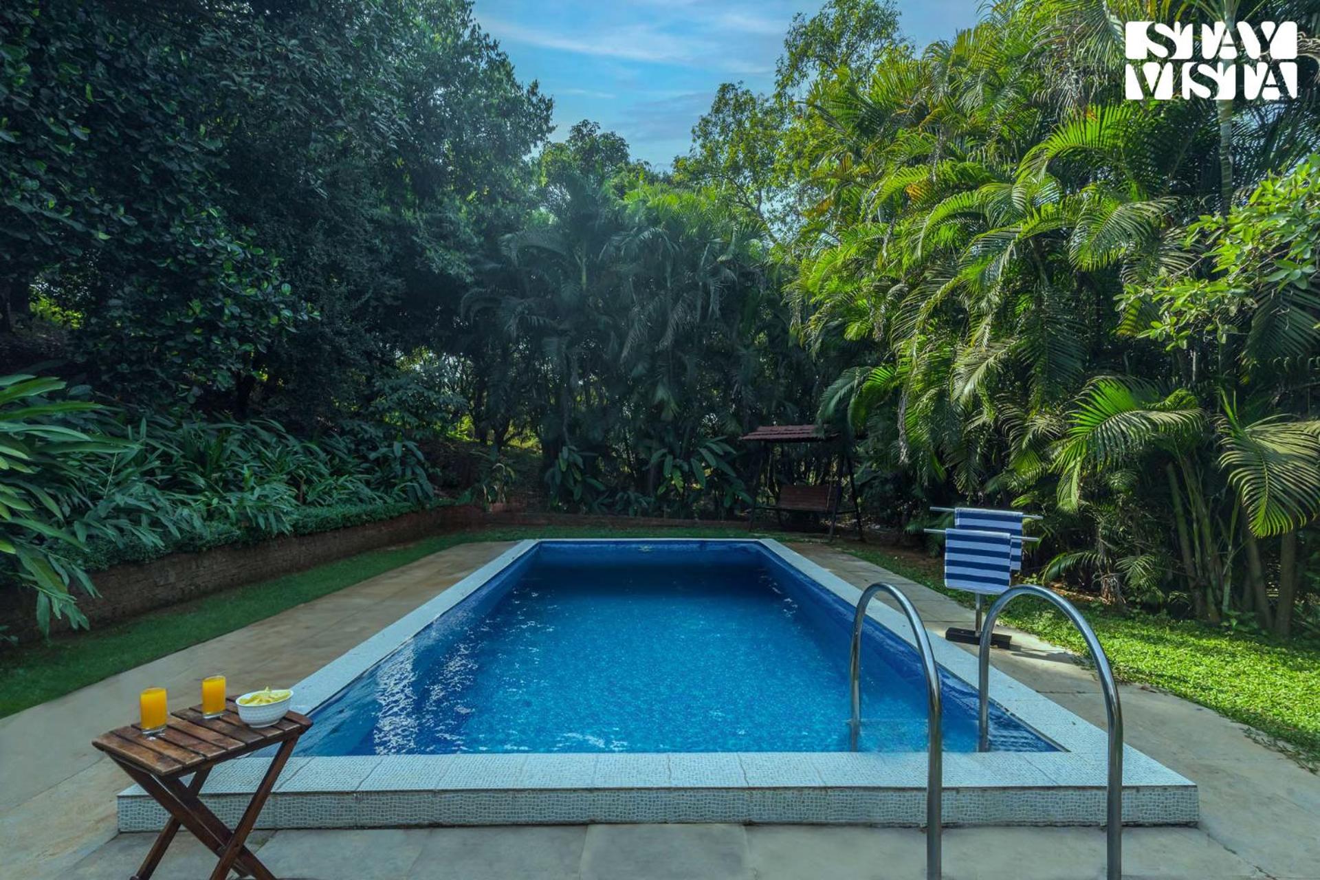 StayVista's Kia Ora - Amidst Greenery Villa with Outdoor Pool, Balconies, and Indoor Games view 3