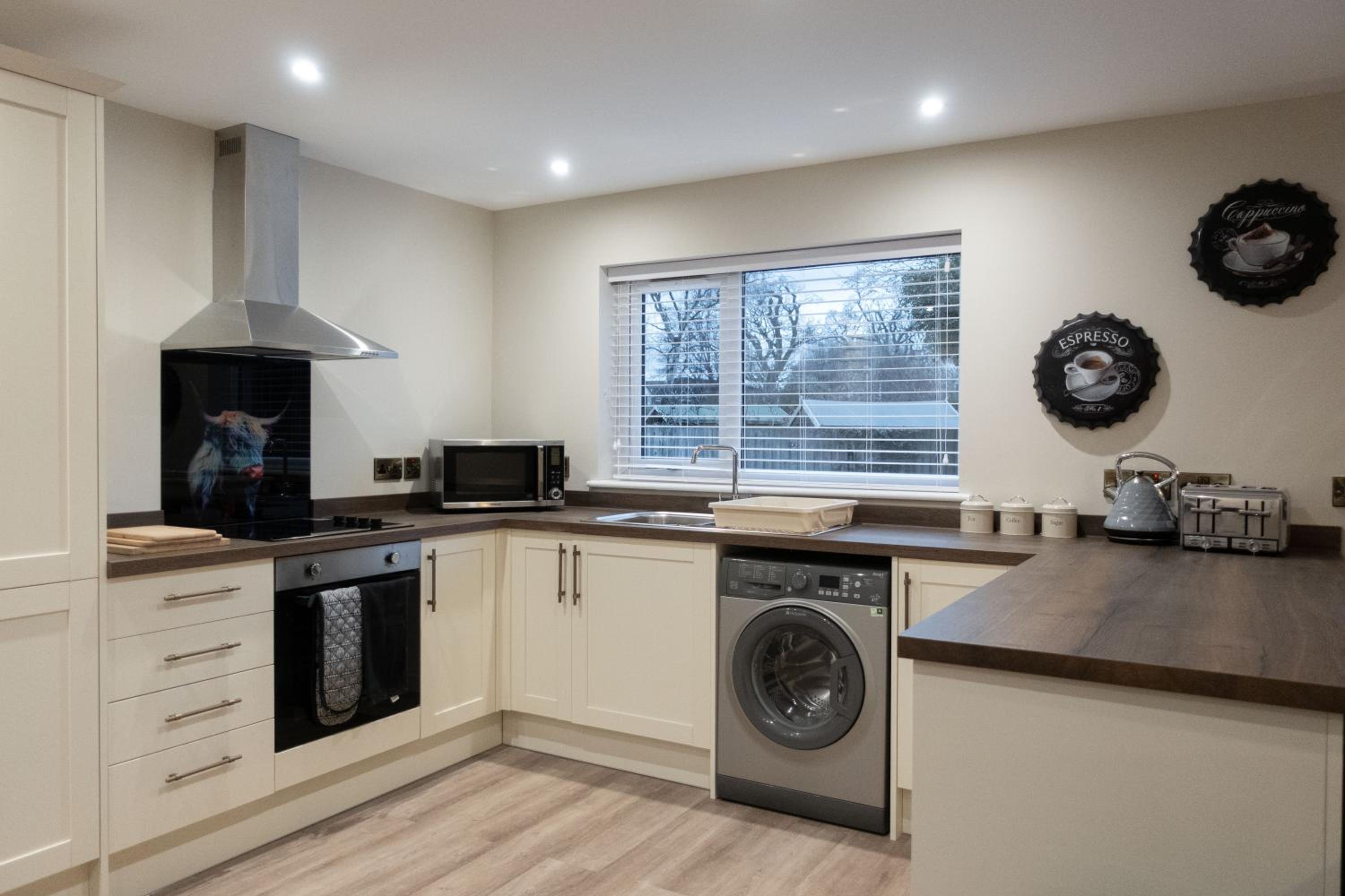 Contemporary new build with parking & garden in central location