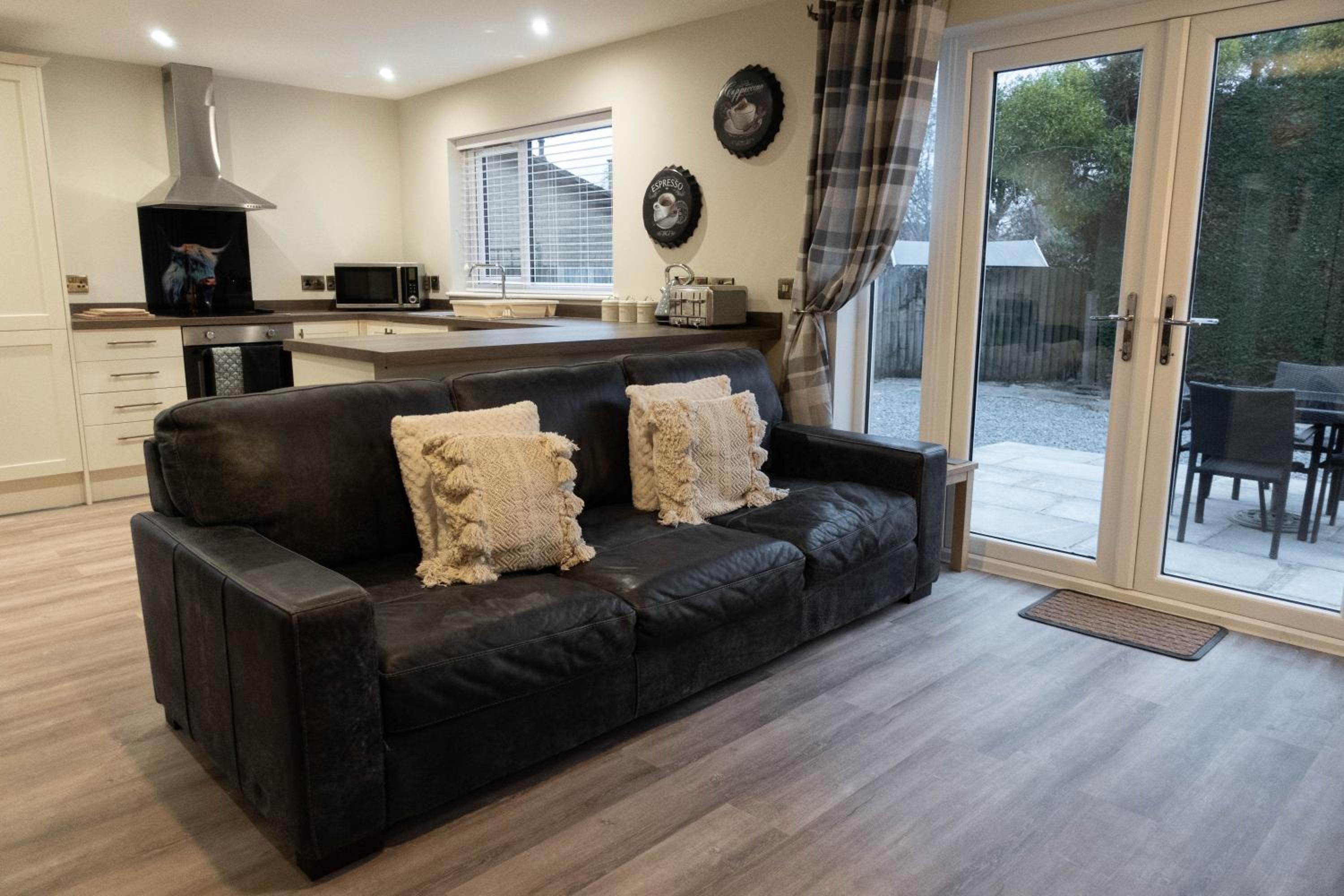 Contemporary new build with parking & garden in central location