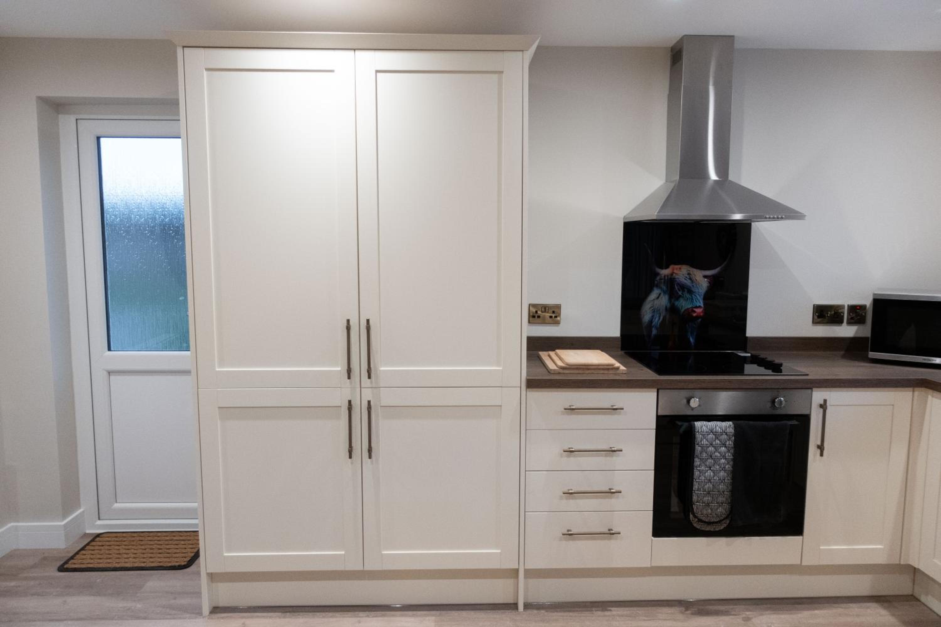 Contemporary new build with parking & garden in central location