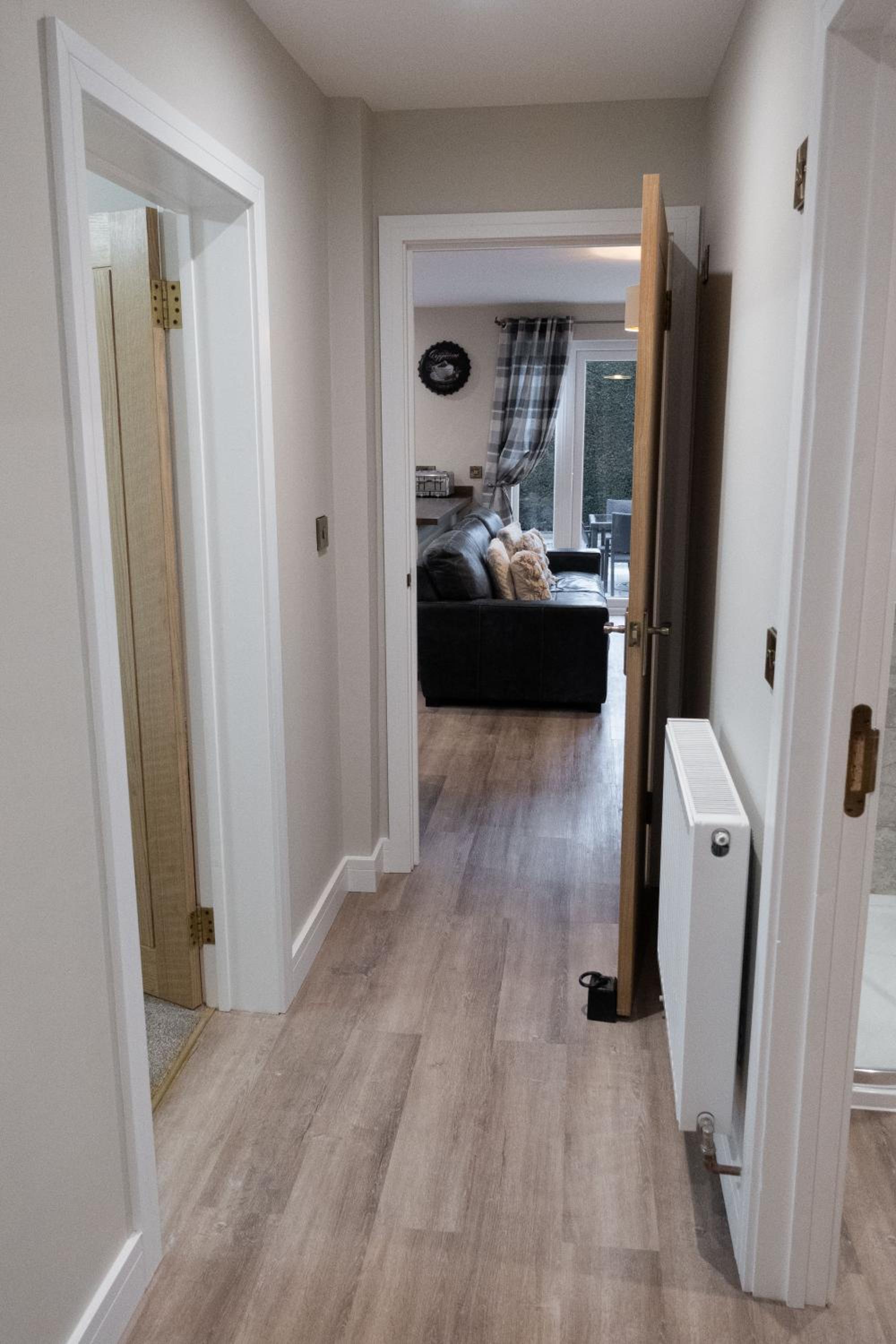 Contemporary new build with parking & garden in central location