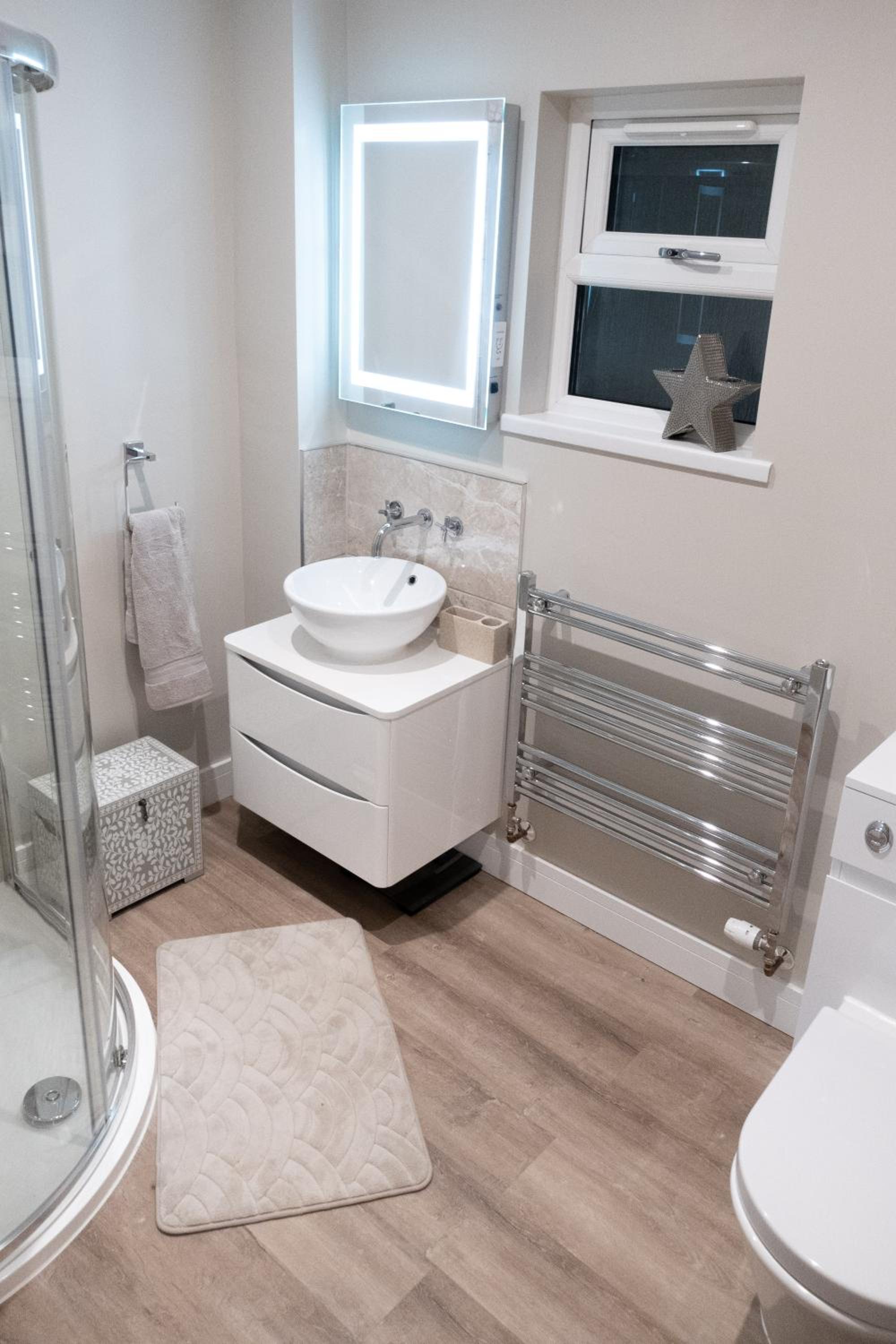 Contemporary new build with parking & garden in central location