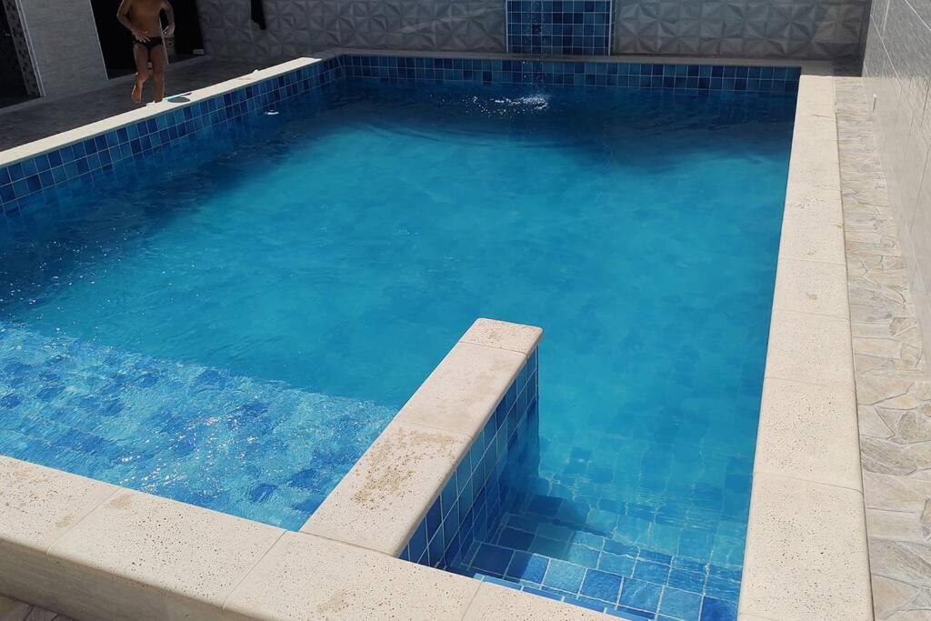 Casa com piscina na praia.