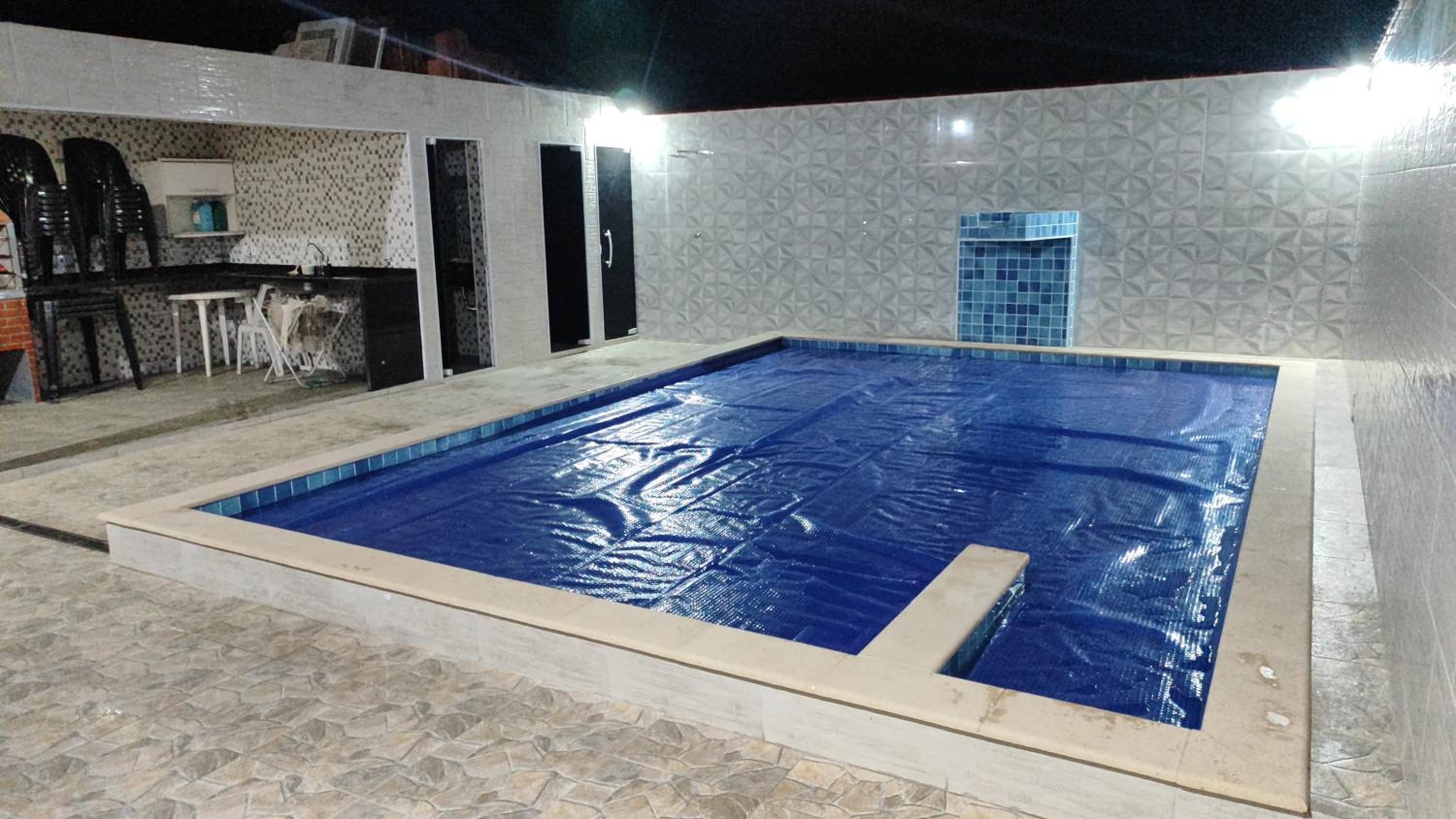Casa com piscina na praia.