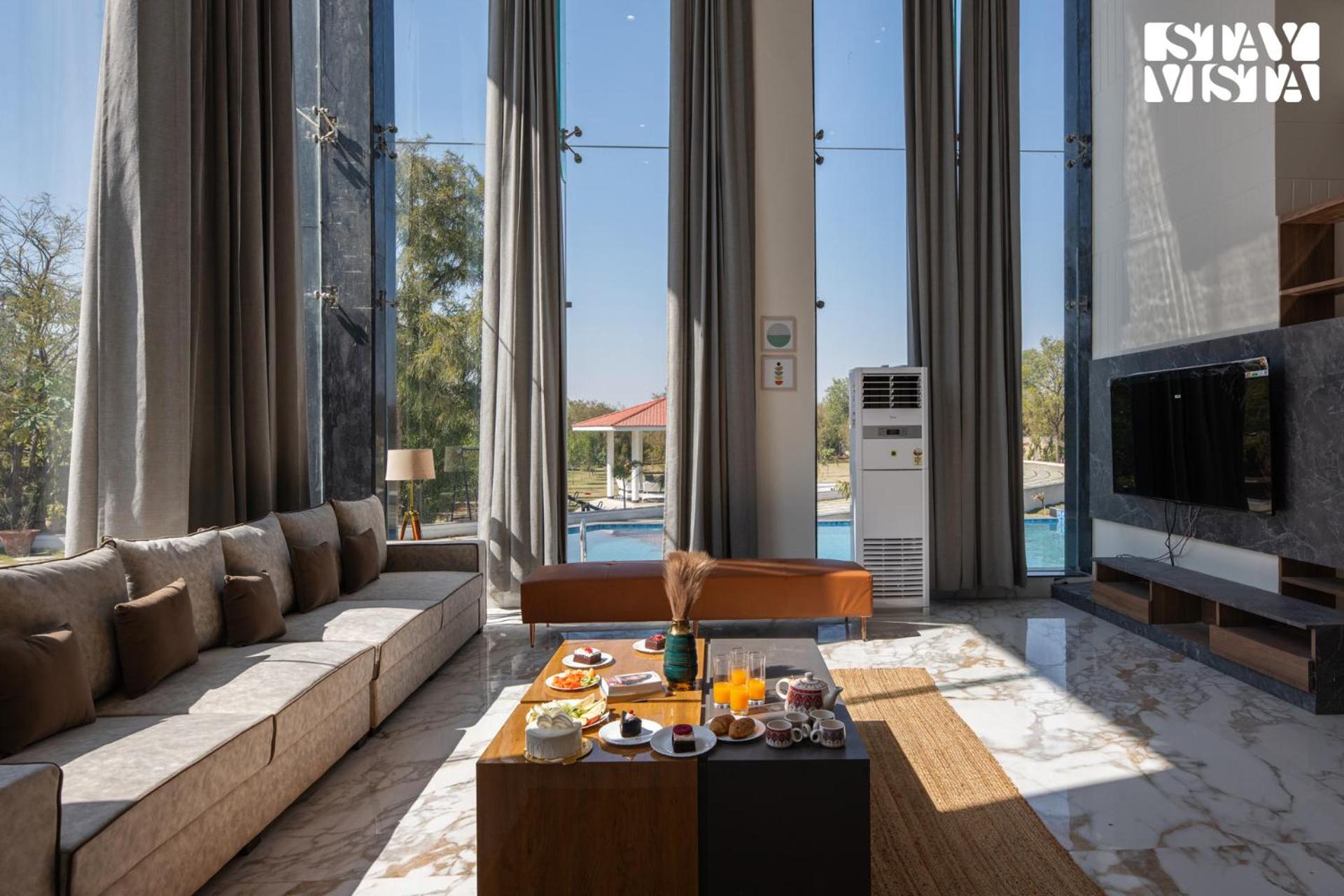 StayVista's Avadh Vatika - Mountain-View Villa with Outdoor Pool, Lawn featuring a Gazebo & Bar view 4