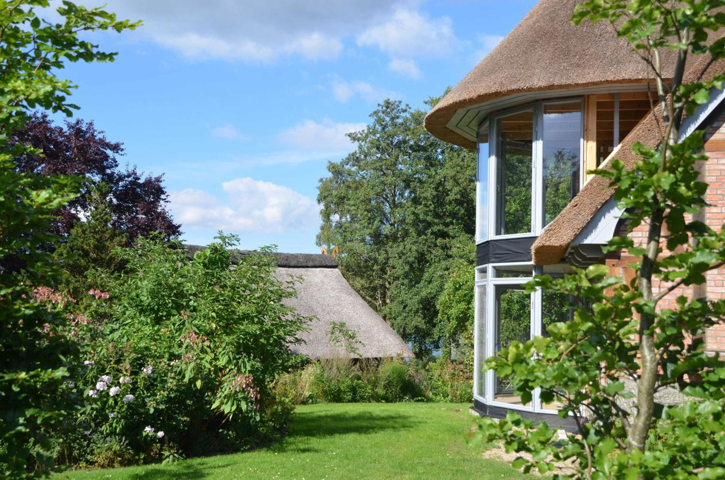Reetgedecktes Espenhaus