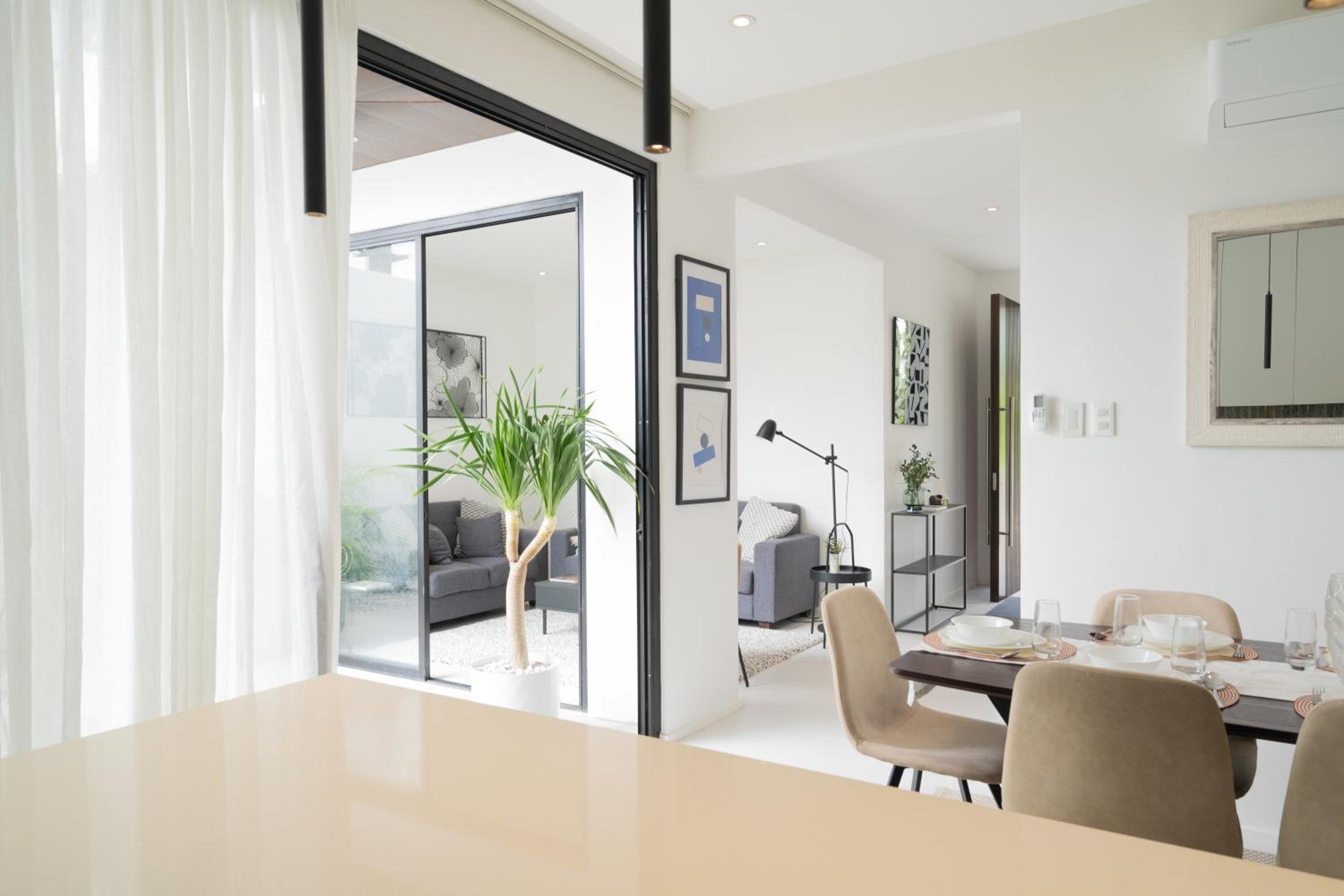 Modern 4 Bedroom House I Close to Malls I Swimming Pool I Maximum 12 Guests I by Bleuspace view 2