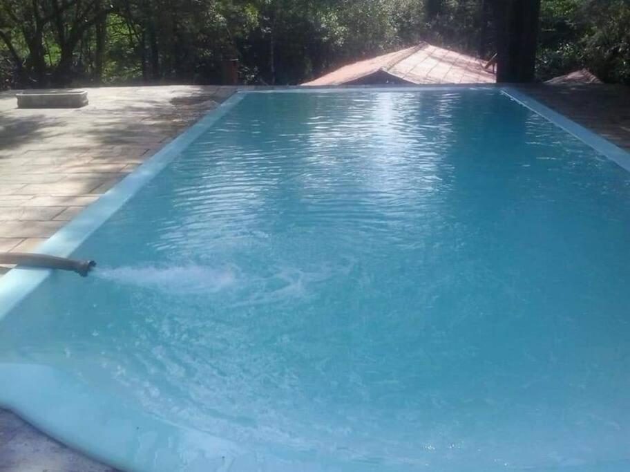 Chácara com piscina em condomínio fechado próx Shopping Outlet Catarina