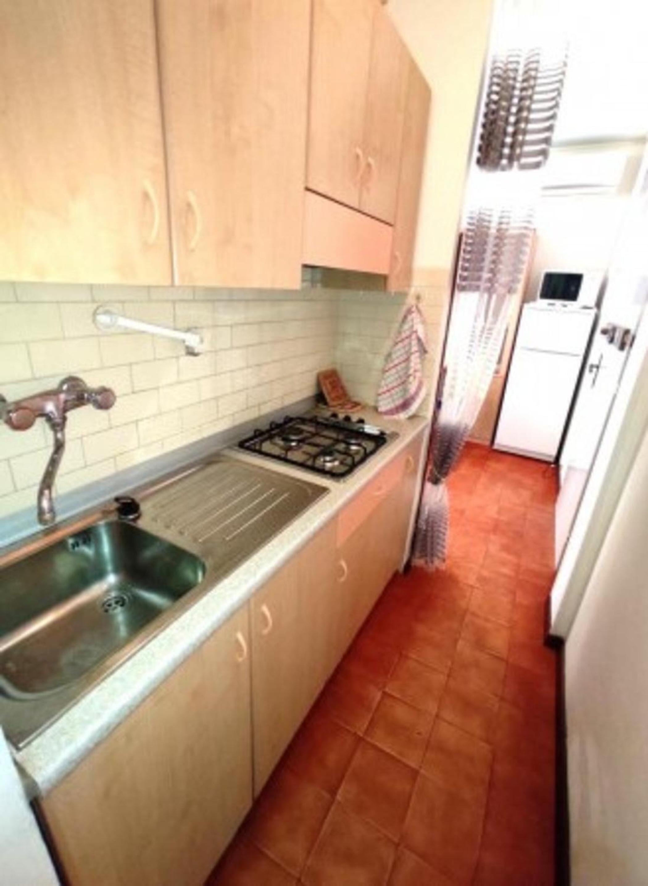 Flat 50m from the beach en Bibione — kitchen