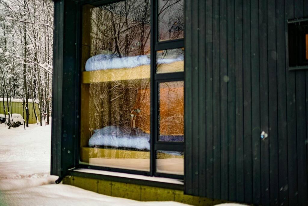 Glass cabin in the woods.