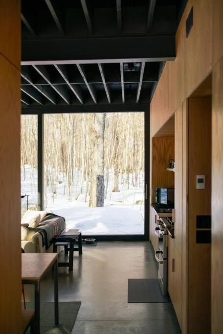 Glass cabin in the woods.