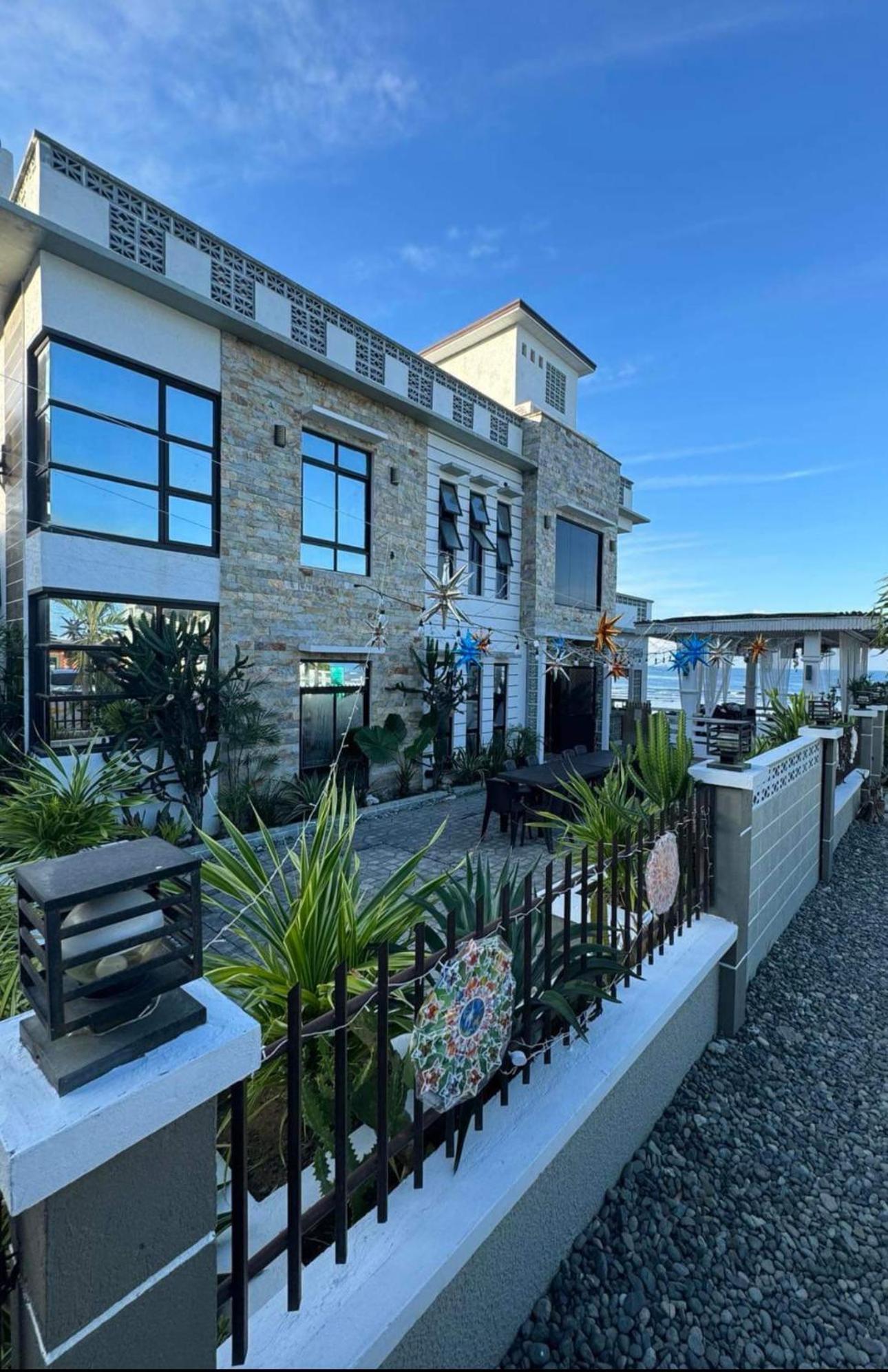 REEF HOUSE BACNOTAN beige sand beach front with Swimming pool