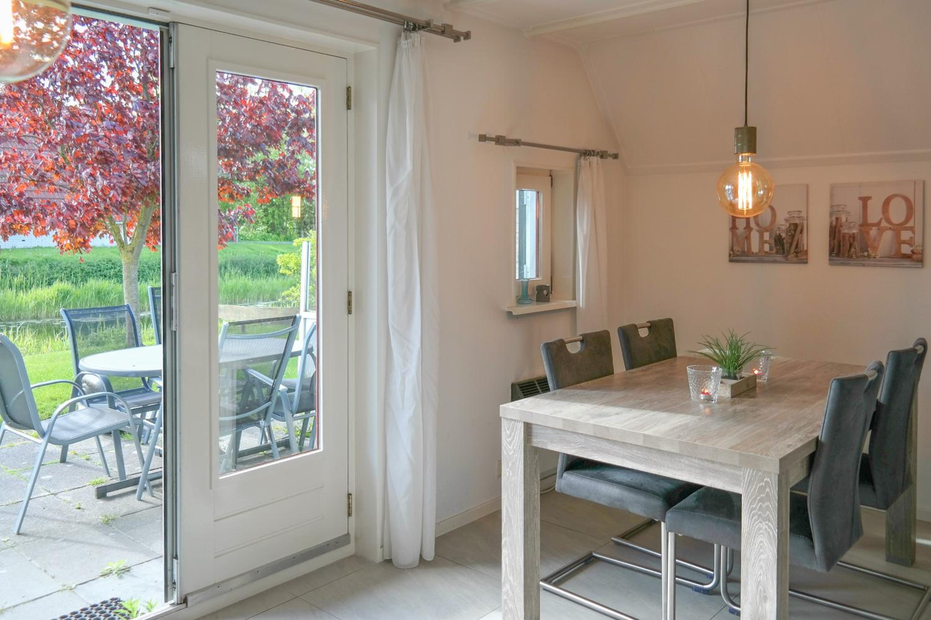 Lilian Modern Holiday home at a typical dutch canal, close to the Lauwersmeer