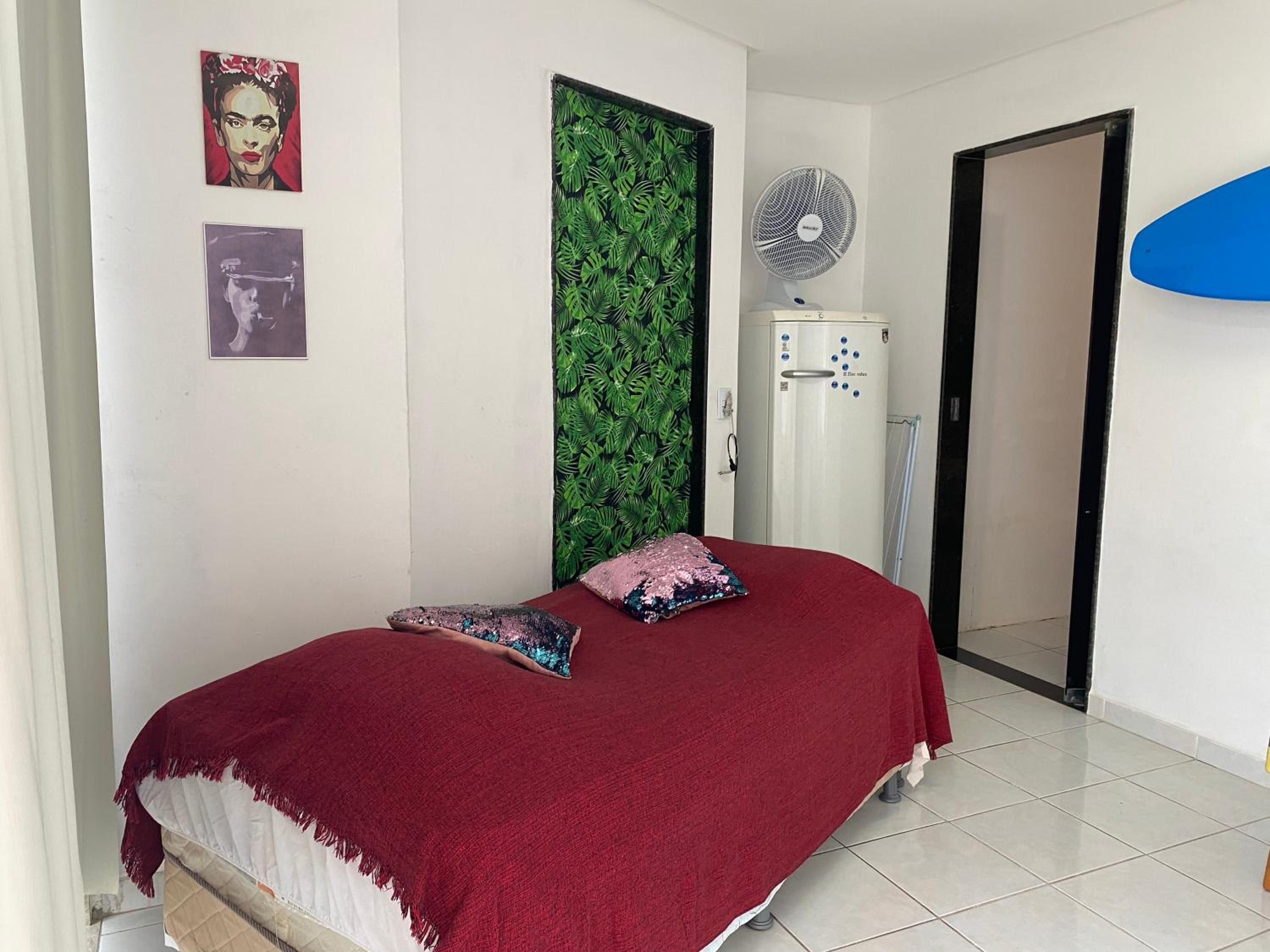 Quarto e sala pé na areia