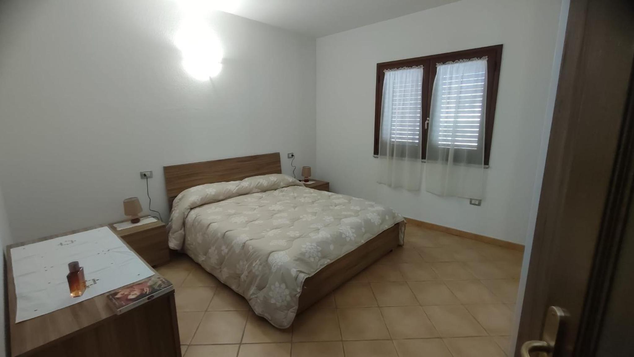Sara Sole & Mare en Torpè — hotel room