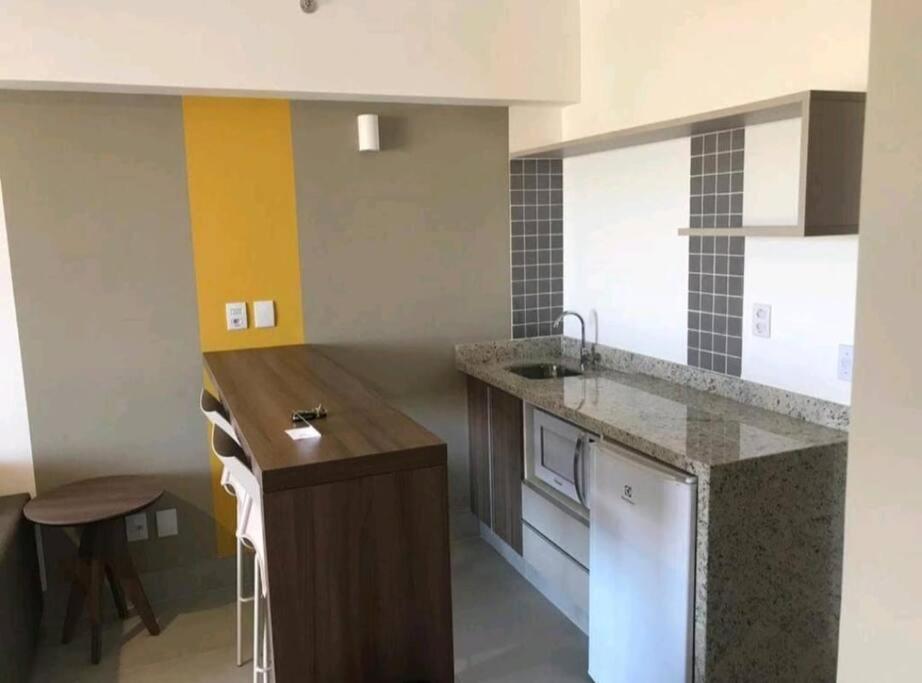 Flat encantador com piscinas aquecidas, academia e playground