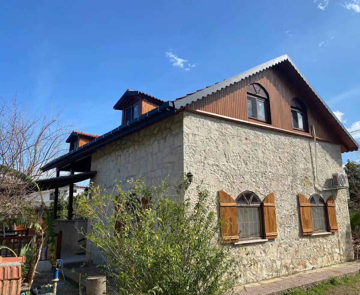 Detached stone house with access to a large garden near beach view 5