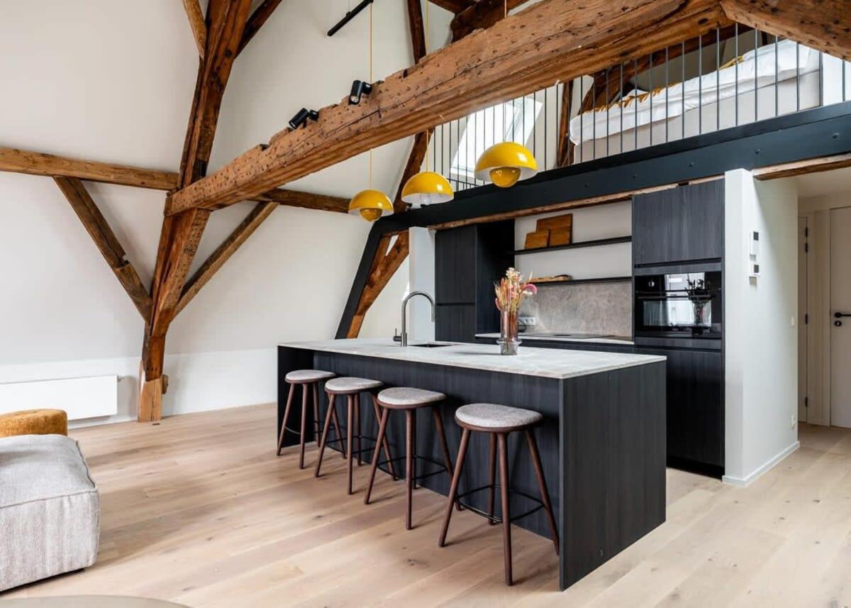 City-view loft with wooden beams and mezzanine