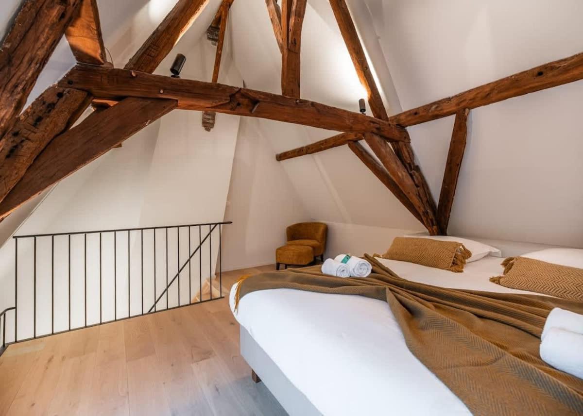 City-view loft with wooden beams and mezzanine