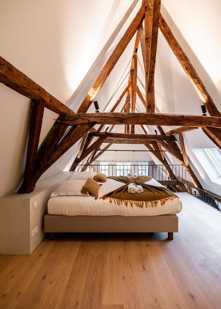 City-view loft with wooden beams and mezzanine