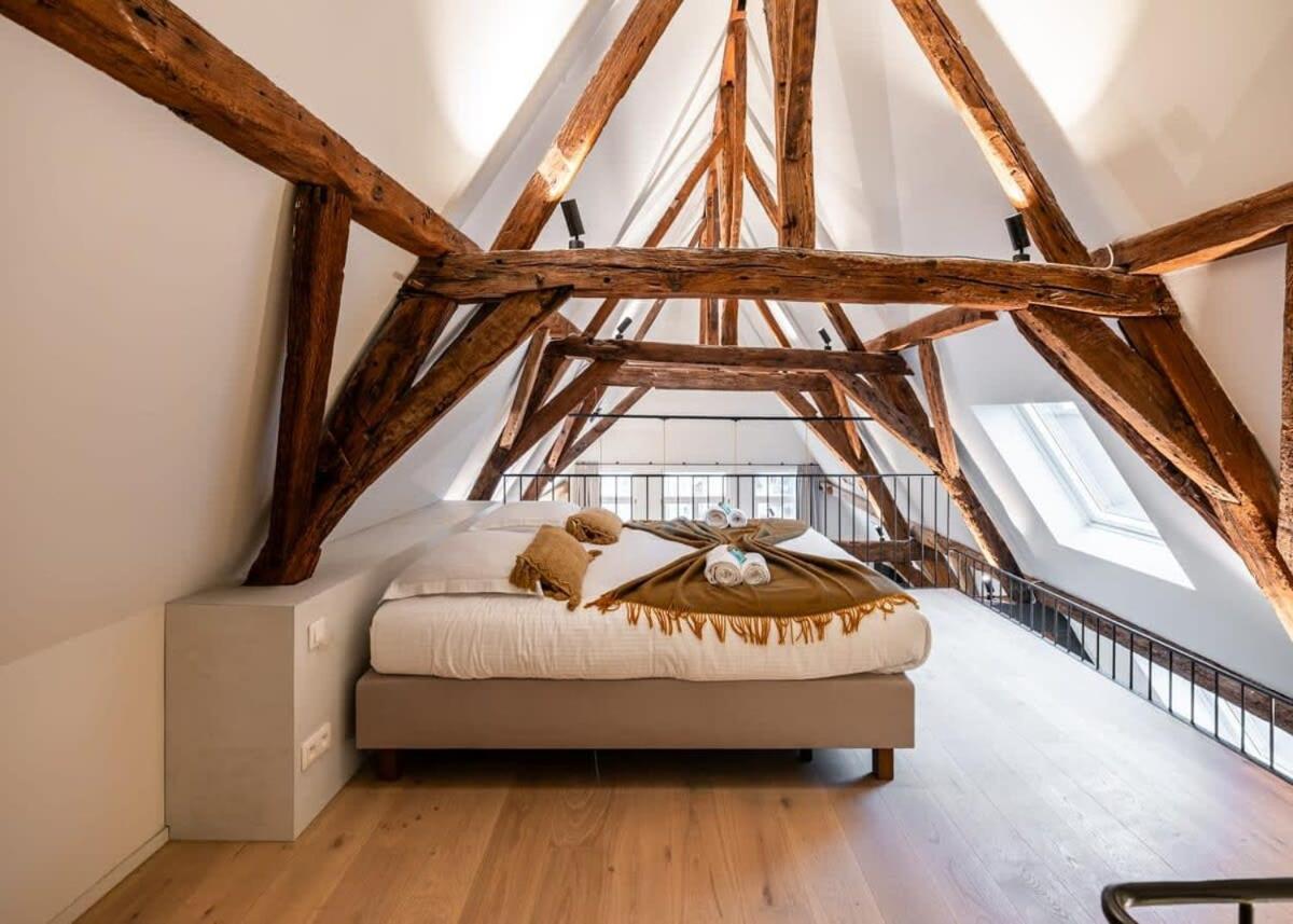City-view loft with wooden beams and mezzanine