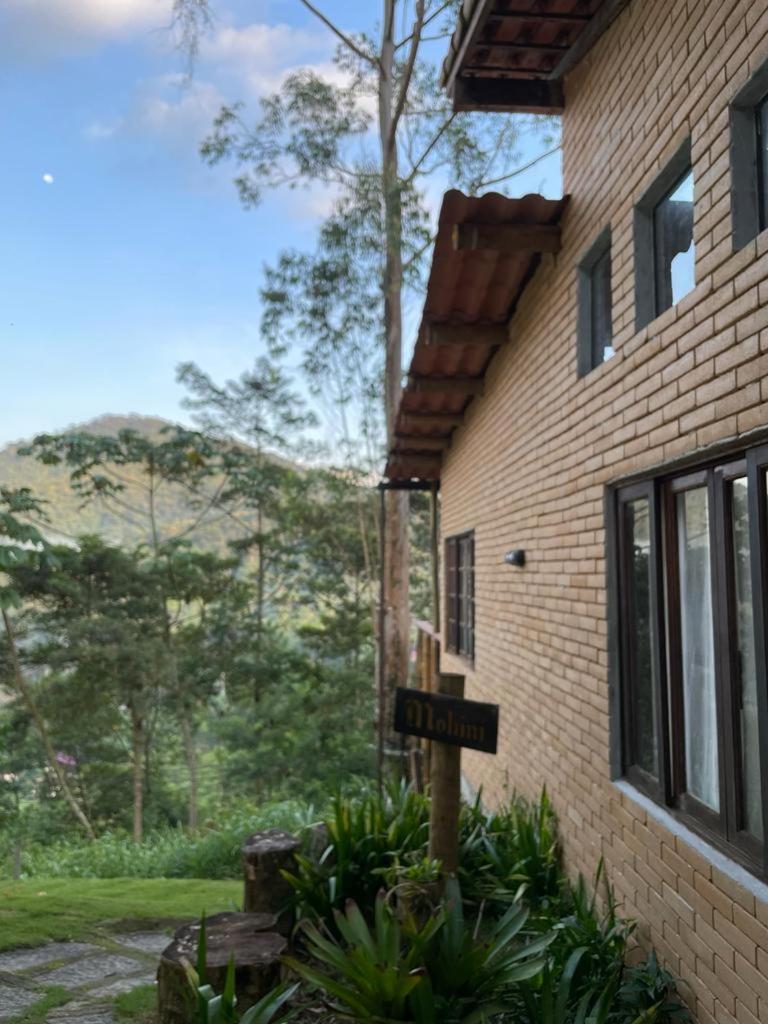 Casa Mohini Refúgio nas montanhas de Teresópolis Quarto com deck rede suspensa lareira cachoeira e piscina