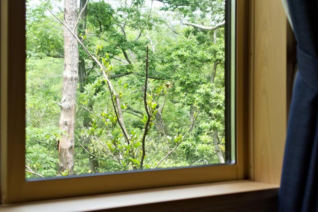 Noto cottage Hinoki no ie - Onsen in a cypress bathtub view 4