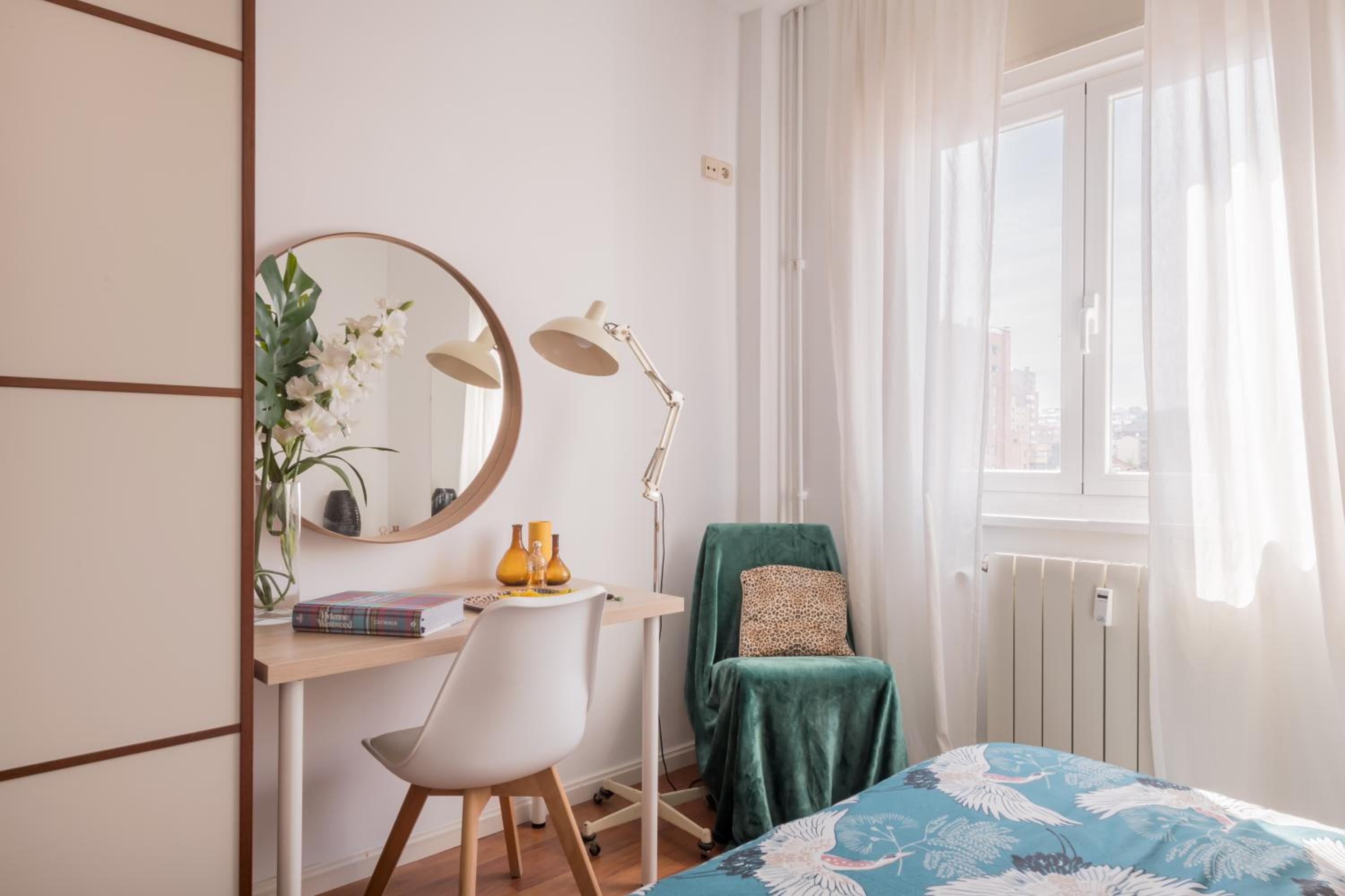 Cozy and Stylish Room with Natural Light and Vibrant Decor