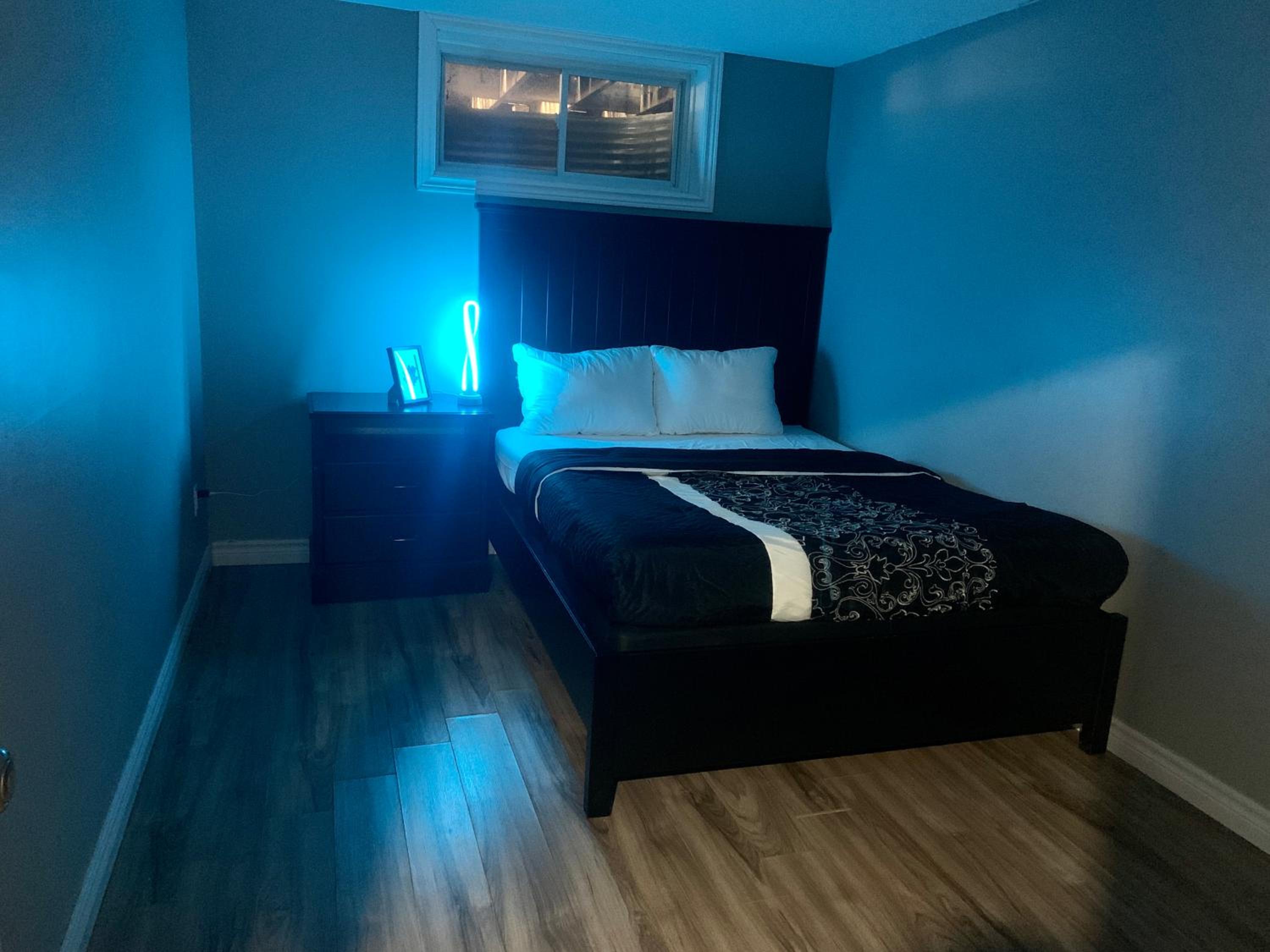 Guelph Vacations - A bedroom in a basement - Property Image 13