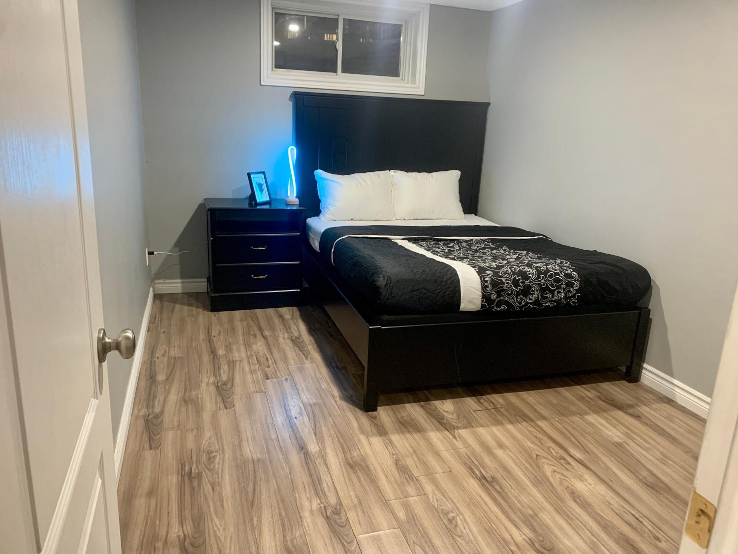 Guelph Vacations - A bedroom in a basement - Property Image 14