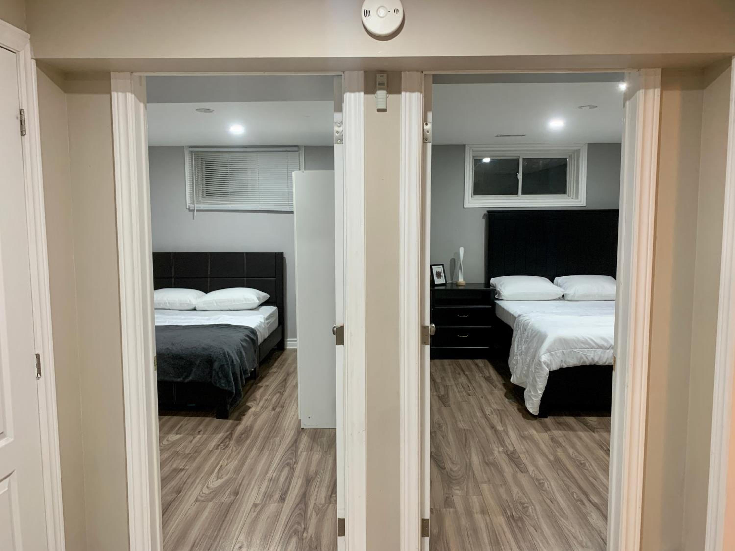 Guelph Vacations - A bedroom in a basement - Property Image 12