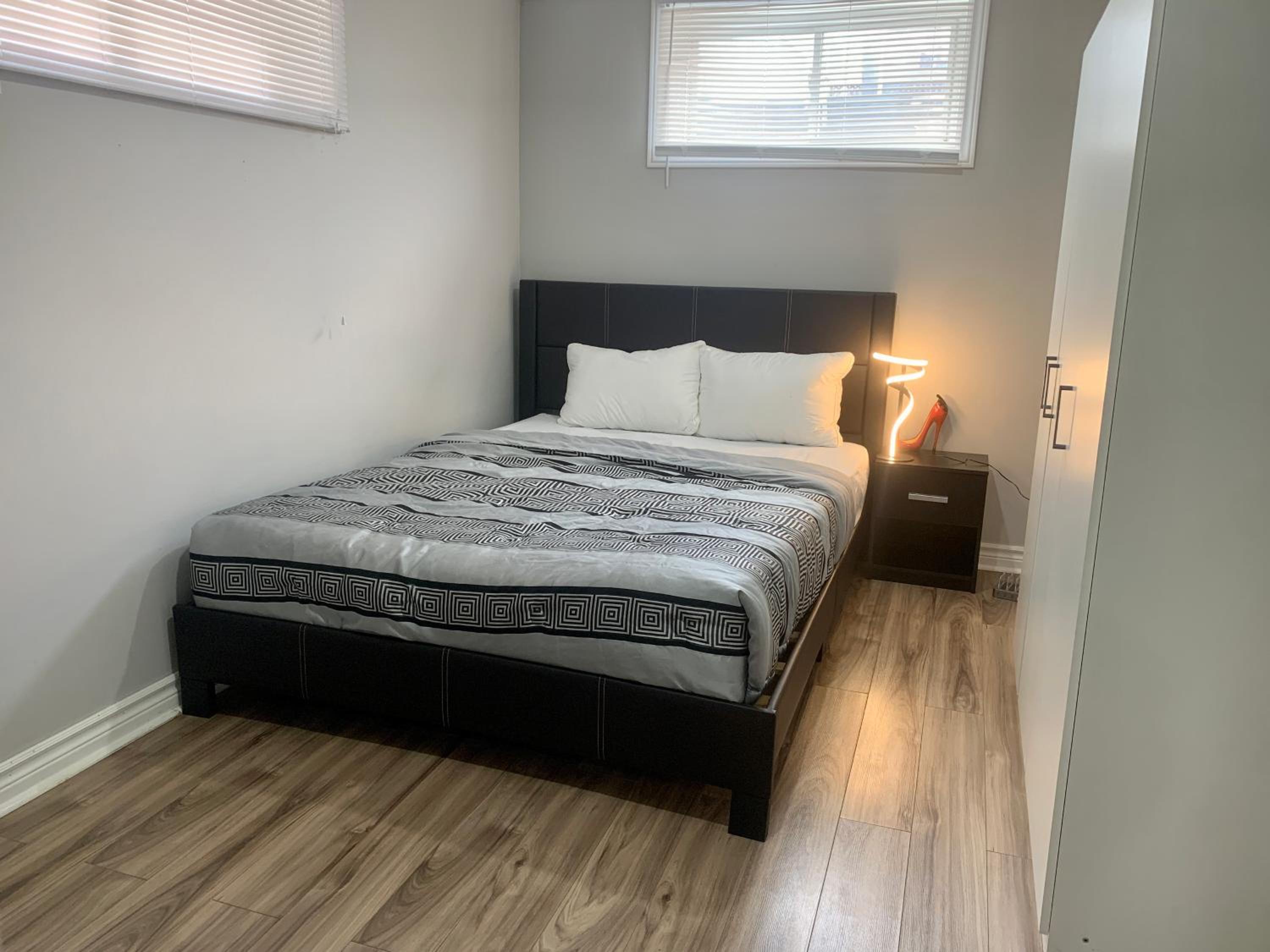 Guelph Vacations - A bedroom in a basement - Property Image 3