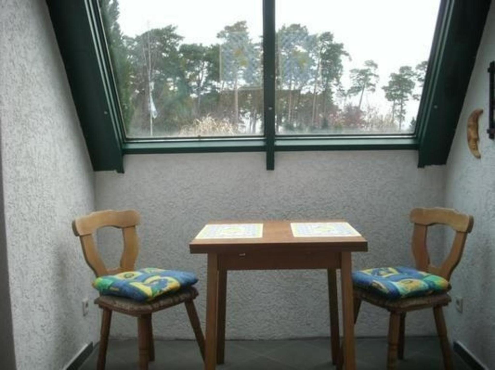 Ferienhaus mit Terrasse mitten im Grünen
